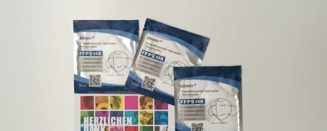 Maskenspende/ Firma IEDAU Karte mit Aufschrift "Herzlichen Dank" und drei FFP2-Masken